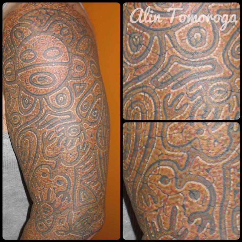 Ainu People Puerto Rico Rock Carving by Alin Tomoroga TattooNOW